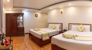 Ένα ή περισσότερα κρεβάτια σε δωμάτιο στο Thanh Do Hotel