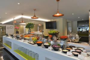 a buffet line with many different types of food at Le D'Tel Bangkok in Bangkok