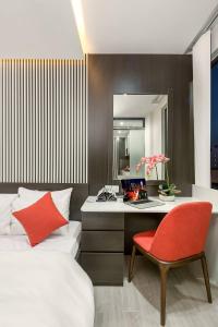 Giường trong phòng chung tại My Suites Danang Beach