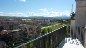 a view of a city from the balcony of a building at Al Pergolesi B&B in Iesi
