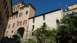 an old building with an archway in a city at Al Pergolesi B&B in Iesi