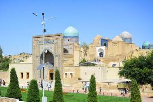 a building with domes on top of a hill at Alisher B&B Hotel in Samarkand