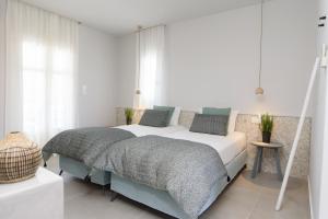 a bedroom with a large bed in a room at Vigla Hotel in Aegiali