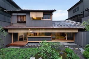 a contemporary house with a view of the backyard at Kyo no Ondokoro NISHIJIN VILLA #5 in Kyoto