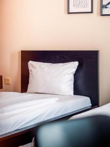 Postel nebo postele na pokoji v ubytování Hotel Berliner Bär