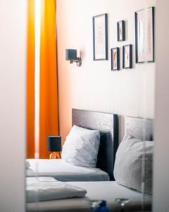 Postel nebo postele na pokoji v ubytování Hotel Berliner Bär