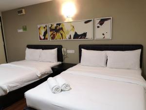 Postel nebo postele na pokoji v ubytování Hotel Sunjoy9 OKR