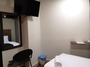 Postel nebo postele na pokoji v ubytování Hotel Sunjoy9 OKR