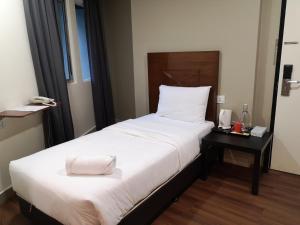 Postel nebo postele na pokoji v ubytování Hotel Sunjoy9 OKR