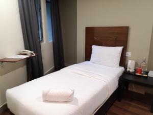 Postel nebo postele na pokoji v ubytování Hotel Sunjoy9 OKR