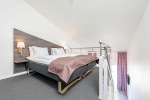 Postel nebo postele na pokoji v ubytování Thon Hotel Surnadal