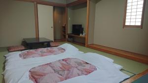 Postel nebo postele na pokoji v ubytování Hotel Oak Forest