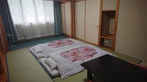 Postel nebo postele na pokoji v ubytování Hotel Oak Forest