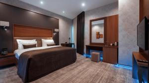 Postel nebo postele na pokoji v ubytování Midtown Hotel Baku