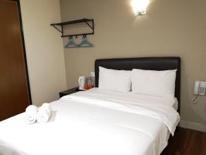Postel nebo postele na pokoji v ubytování Hotel Sunjoy9 OKR