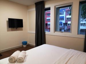 Postel nebo postele na pokoji v ubytování Hotel Sunjoy9 OKR