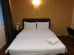 Postel nebo postele na pokoji v ubytování Hotel Sunjoy9 OKR