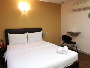 Postel nebo postele na pokoji v ubytování Hotel Sunjoy9 OKR