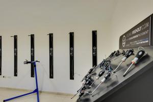 a display case with a row of baseball bats at Cala Millor Garden Hotel - Adults Only in Cala Millor