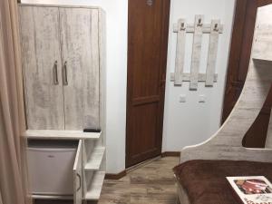 a room with a closet and a bed and a cabinet at Cottage Euro Style in Ureki +67 photos