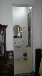 a bathroom with a sink and a mirror at Hue Railway Hotel in Hue