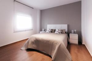 En eller flere senge i et værelse på Apartamento La Terraza del Mar