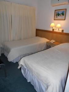 Voodi või voodid majutusasutuse Tanger Hotel toas