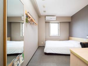 Voodi või voodid majutusasutuse Super Hotel Fuji Inter toas +37 fotot
