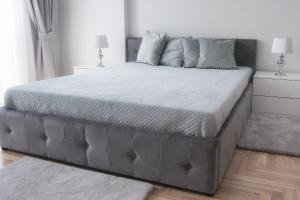 Posteľ alebo postele v izbe v ubytovaní AMN APARTMENTS