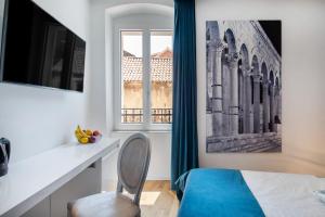 Televízia a/alebo spoločenská miestnosť v ubytovaní Luxury rooms Paula