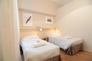 
A bed or beds in a room at Melarancio 3 - Keys Of Florence
