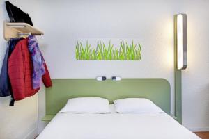Postel nebo postele na pokoji v ubytování Hotel Ibis Budget Vichy