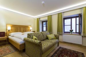 Łóżko lub łóżka w pokoju w obiekcie Hotel-Restaurant Kirchenwirt