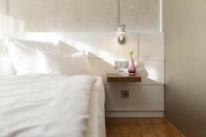 Postel nebo postele na pokoji v ubytování Factory Hotel