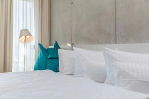 Postel nebo postele na pokoji v ubytování Factory Hotel