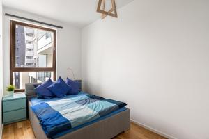 Posteľ alebo postele v izbe v ubytovaní Apartament OdraTower (wroc4night)