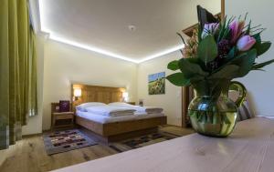 Łóżko lub łóżka w pokoju w obiekcie Hotel-Restaurant Kirchenwirt