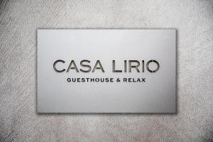 a sign for a casa lirico guest house and relax at Casa Lirio in Barcelona