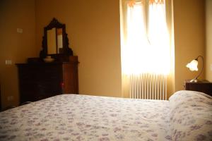 A bed or beds in a room at A Cà Du Barbijun