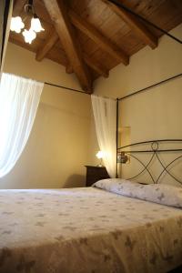 A bed or beds in a room at A Cà Du Barbijun