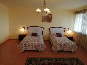 Postel nebo postele na pokoji v ubytování HOTEL SAN