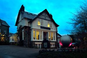 a house with a large orb in front of it at Windermere Boutique Hotel in Windermere