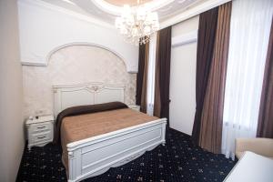 En eller flere senge i et værelse på Готель Петрівський