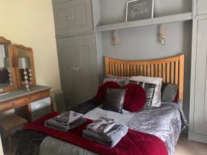 a bedroom with a bed with towels on it at Peniarth arms in Llanegryn