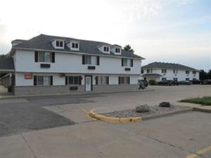 a large white house with at Sunset Inn and Suites in Seward
