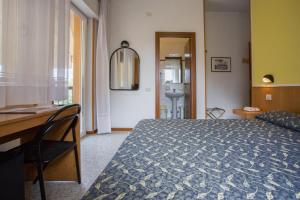 Postel nebo postele na pokoji v ubytování Hotel Benacus