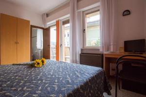 Postel nebo postele na pokoji v ubytování Hotel Benacus
