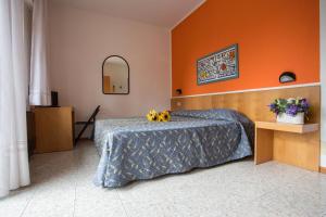 Postel nebo postele na pokoji v ubytování Hotel Benacus