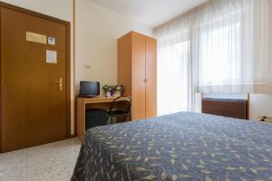 Postel nebo postele na pokoji v ubytování Hotel Benacus