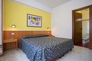 Postel nebo postele na pokoji v ubytování Hotel Benacus